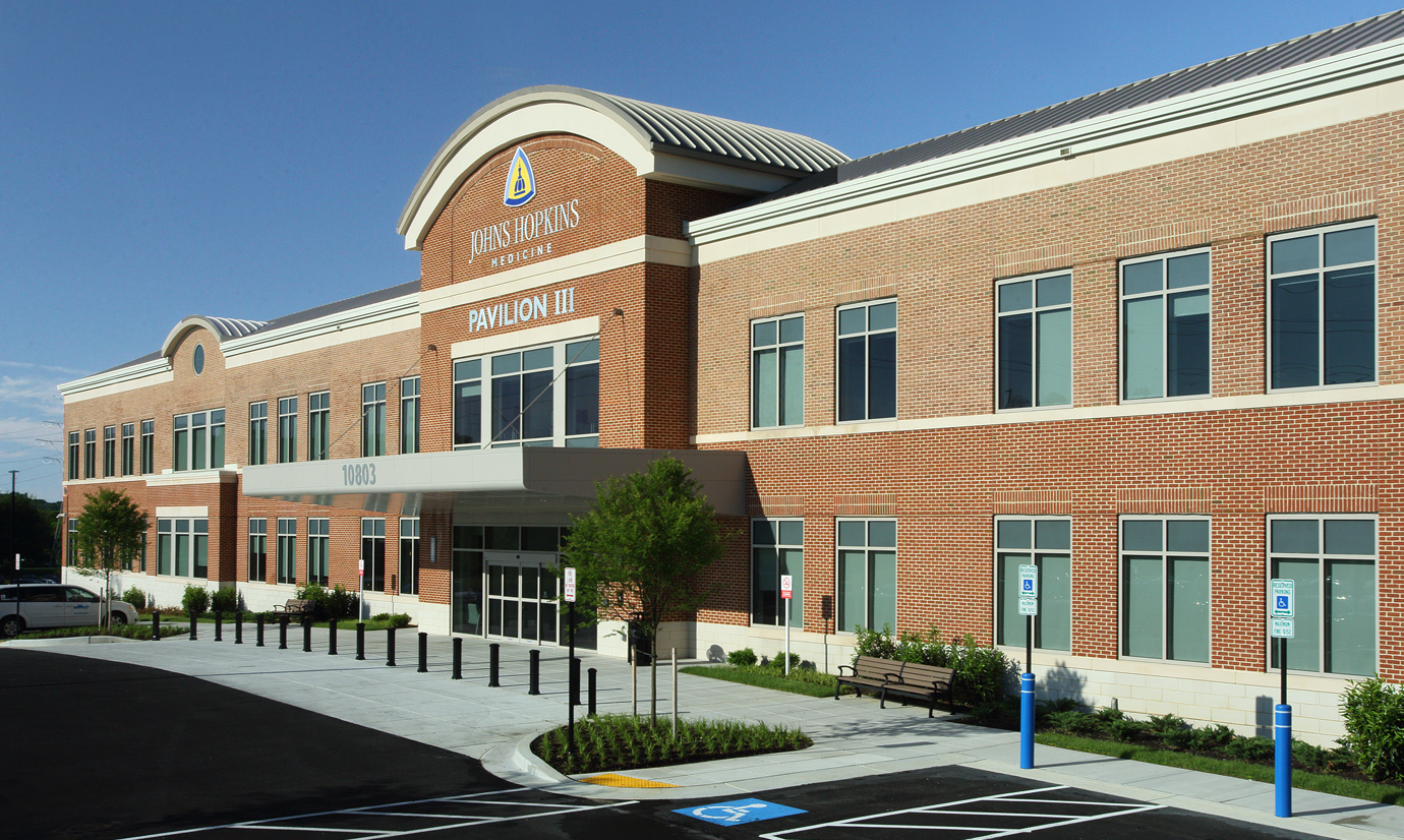 A photo shows the newest building at Johns Hopkins Health Care & Surgery Center — Green Spring Station.